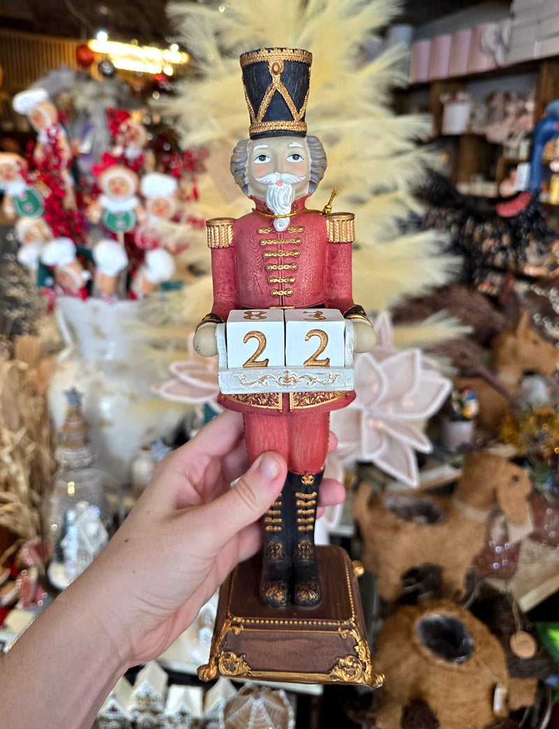 Nutcracker with golden details and calendar